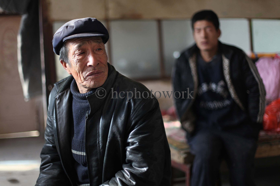 Cao Jun Li 曹俊立 (left) and her uncle Cao 曹 who is blinded with cataracts struggle to find a little farm work worry about money and taking care of their little granddaughter/niece. HIV in China.
